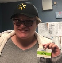 Employee Holding Up Name Tag
